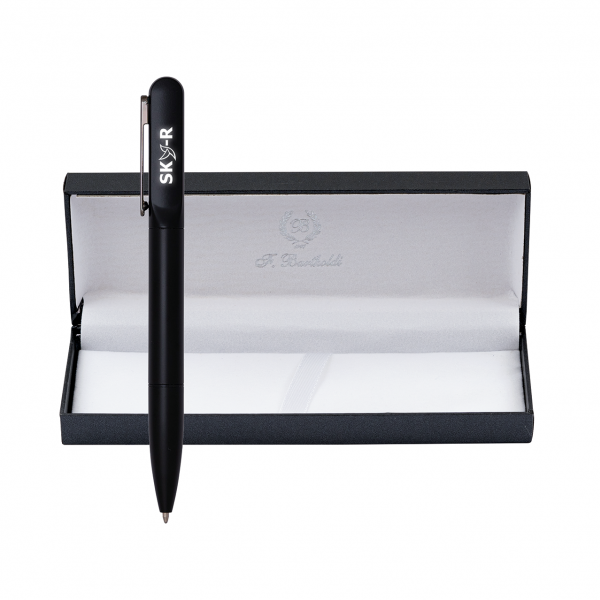 Black Ostin pen with white lettering and a silver-coloured clip standing in front of an open black box with white lining