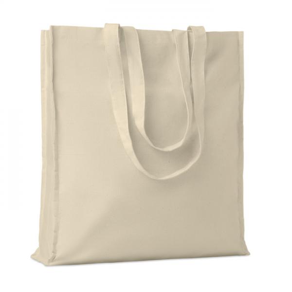 Beige shopping bag in an angled view with long handles and a visible side gusset
